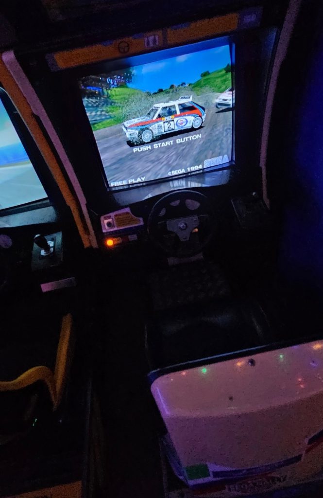 Sega Rally Championship sit-down racing cabinet with steering wheel