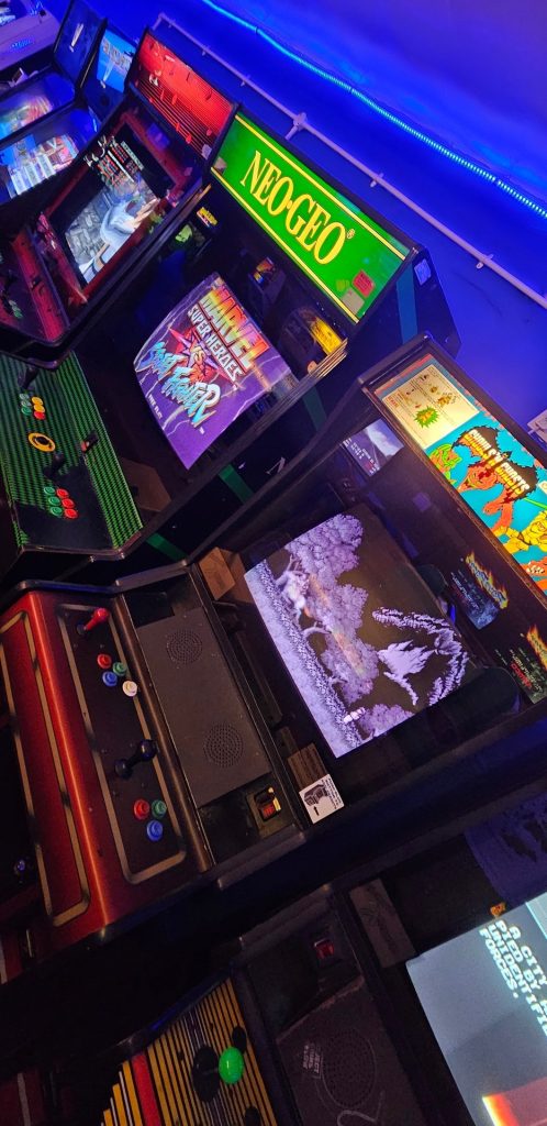 Bank of cabinets including Neo Geo, Marvel vs Street Fighter and Ghosts n Goblins
