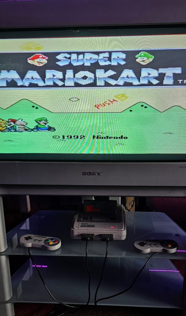 Super Nintendo running Super Mario Kart on a CRT