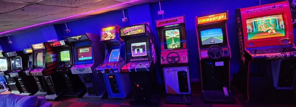 Row of classic uprights including Toobin, Blasteroids, Over Drive and Final Lap