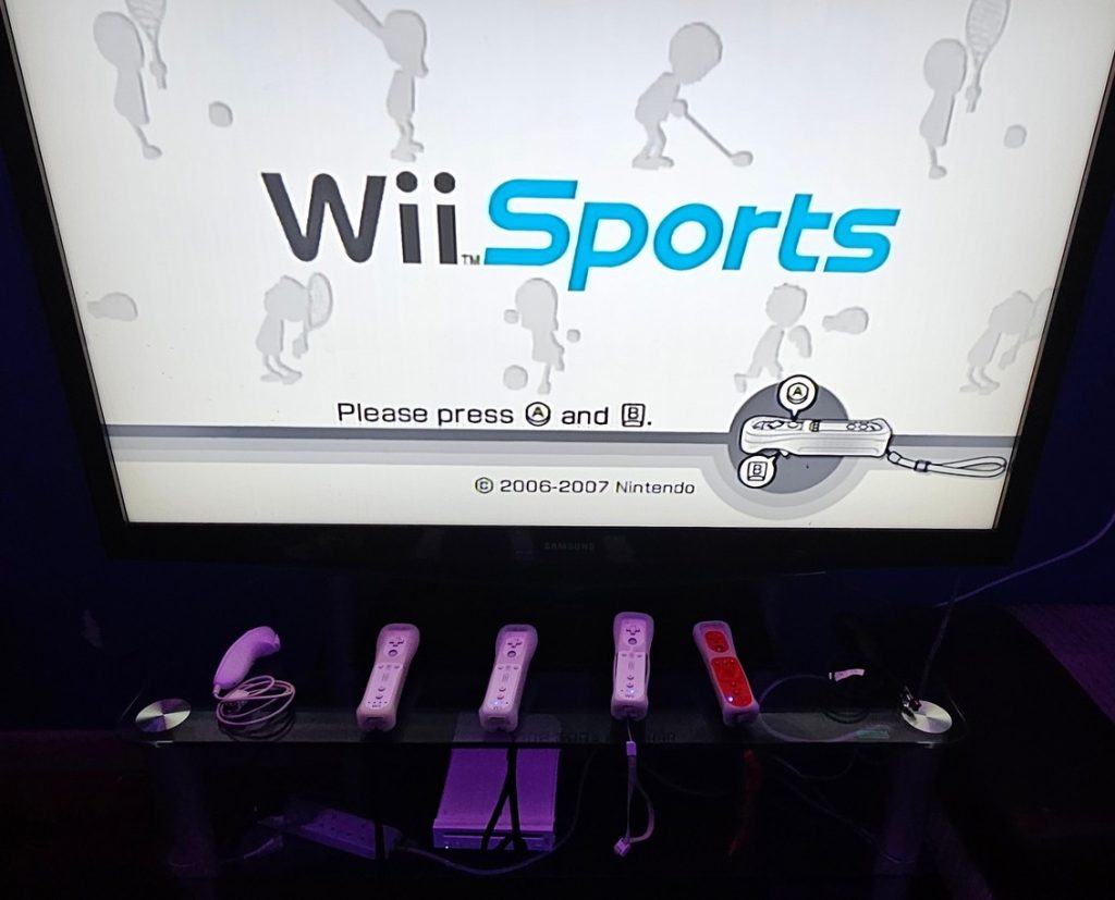 Nintendo Wii running Wii Sports with remotes lined up